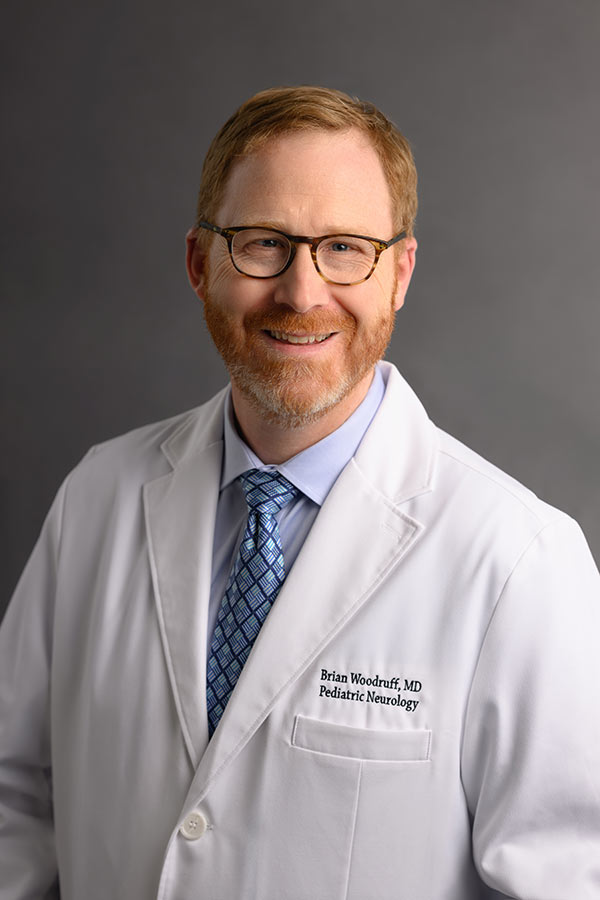 Portrait of Brian E. Woodruff, MD, a board-certified pediatric neurologist.